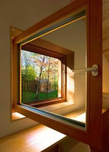 a window in a door with a view of a yard at Architectural Cabin 18 mins to Catamount in Taghkanic