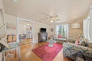 a living room with a couch and a table at Suite Elliana w/Hot Tub & Outdoor Fireplace! in Fredericksburg