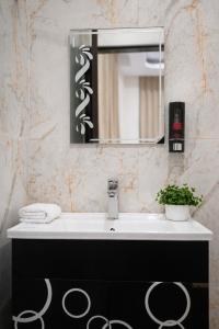 a bathroom with a sink and a mirror at Moon and Root in Narendranagar +24 photos