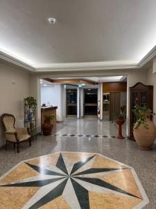 an office lobby with a geometric floor at Da Beppe in Chiesina Uzzanese