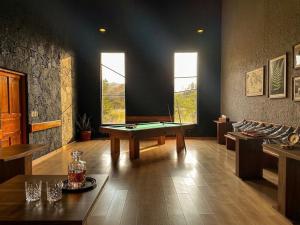 a room with a pool table in the middle of it at Orgánico Hotel Boutique TEPOZTLÁN in Tepoztlán