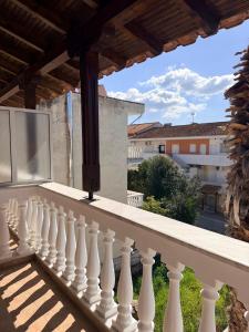 a balcony with a view of a building at Kallithea Cove in Kallithea Halkidikis