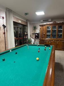 a pool table with balls on it in a room at Da Beppe in Chiesina Uzzanese