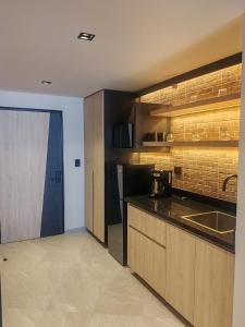 a kitchen with a sink and a counter top at STREET MALL Luna N6-3 in Puebla
