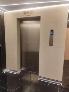 an elevator in a building with a metal door at STREET MALL Luna N6-3 in Puebla