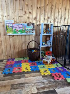 a childs play area with a rug on the floor at Tiny House at Sedliacky Dvor - Brezno in Brezno
