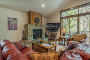 a living room with a couch and a fireplace at 4BR Home w/ 2 Decks, Near Lake & Ski Resorts in Truckee