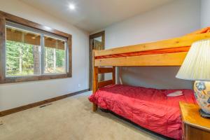 a bedroom with a bunk bed and a window at 4BR Home w/ 2 Decks, Near Lake & Ski Resorts in Truckee