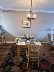 a dining room with a table and chairs at Mountain View Condo 3702 in Pigeon Forge