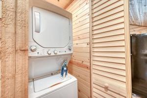 a washer and dryer in a tiny house at Rustic Cabin with Firepit and Grill - 10 mins to Main St in Rocky Hill +17 photos
