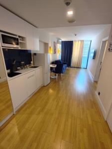 an empty room with a kitchen and a living room at best VIP HOTEL panorama suites IN batumi R in Batumi
