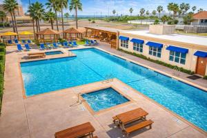 an overhead view of a swimming pool at a resort at Gulfview II #410 Luxe in South Padre Island