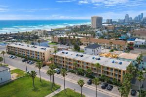 an aerial view of a hotel and the ocean at Fiesta Sol #110 in South Padre Island