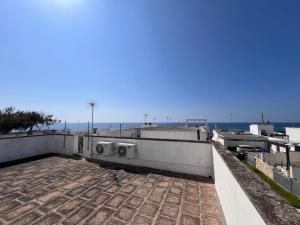 a view of the ocean from the roof of a building at Villetta Capilungo by Paf in tour in Capilungo