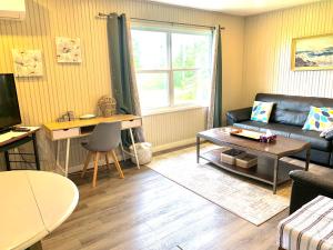 a living room with a couch and a table at 8 Clarence Ln in Cavendish +11 photos