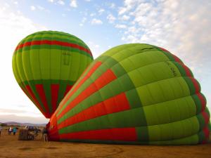 two large green and red hot air balloons at Riad Nejma Benyoussef in Marrakesh