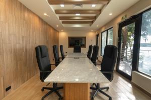 a conference room with a long table and chairs at Cristalino Lagoon Front Hotel, Restaurant & Spa in Bacalar +63 photos