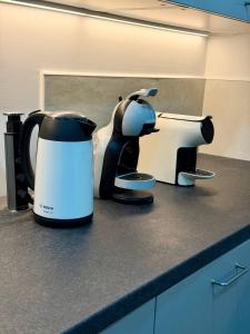 a coffee maker sitting on top of a counter at Residencial Princesa do Ave in Vila do Conde