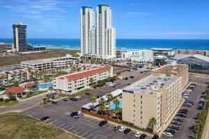 an aerial view of a city with buildings and the ocean at Great Pool - Beach Access - Small Family Perfect in South Padre Island