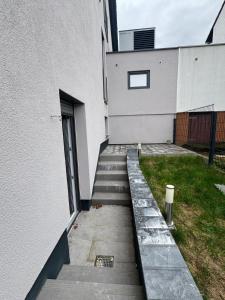 a stairway leading up to a building with a door at Elfis Paradise in Wiesbaden