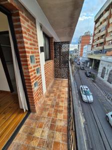 a balcony of a building with a view of a street at Deptos Boutique in San Salvador de Jujuy