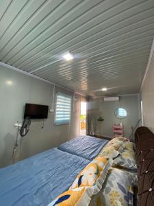a bedroom with a large bed in a room at CTZ PAROH RIVER PARK in Jertih +14 photos
