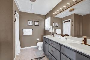a bathroom with a large sink and a toilet at Casa Blanca: Hot-tub, Fire Pit, Hill Country Views in Luckenbach +15 photos