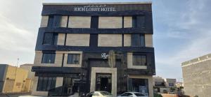 a building with a sign that reads patriarchy hotel at Wahed Numas in Hail