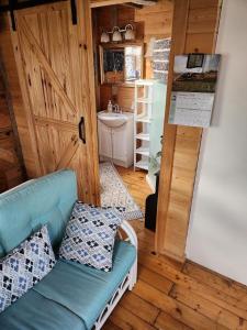 a living room with a couch and a sink at Cable Head Oceanview Casita in Saint Peters +7 photos