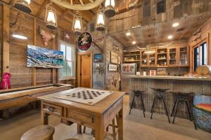 a game room with a table and a counter at 7Cs Sunset Valley Ranch in Fredericksburg