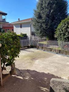 a parking lot in front of a house at CASA QUANZITO -Casa intera con giardino e parcheggio privato, ideale per famiglie in Dervio