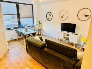 a living room with a couch and a table at b3 - bike & bed bitterfeld in Bitterfeld