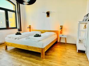a bedroom with two beds in a room at b3 - bike & bed bitterfeld in Bitterfeld