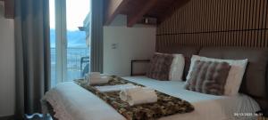 a bedroom with a bed with two towels on it at Luna di miele in Albosaggia