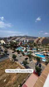 a view of a city with a parking lot at Beachfront apartment in Oropesa del Mar