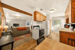 a kitchen and living room with a couch and a table at Red Ivy #5 in Boise