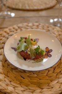 a plate with a piece of food on a table at Le Conche country house in Villamaina