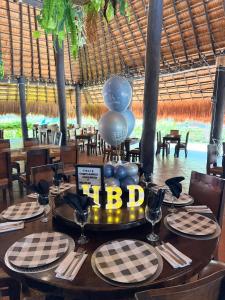 a table in a restaurant with a balloit at Malokas Resort - El Socorro - San Gil in Socorro +55 photos