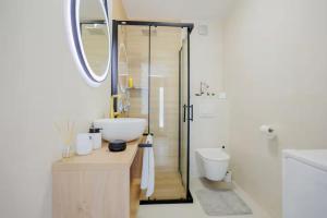 a bathroom with a shower and a sink and a toilet at Exclusive Apartment MARIJA in Strožanac +21 photos