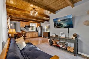 a living room with a couch and a kitchen at The Summit at Sherwood #618 in Big Bear City
