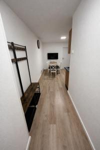 a room with a dining room with a table at Family Apartment near Mölltaler Gletscher 2 in Flattach +5 photos
