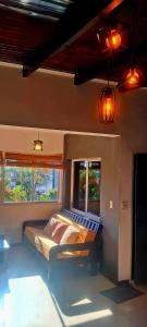 a bedroom with a bed and two windows at Altocostanera in Posadas +17 photos
