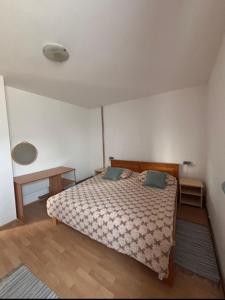 a bedroom with a bed with two pillows on it at Apartment Goran in Poljanak