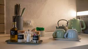a kitchen counter with a bottle of wine and other items at Agriturismo L'Accolta in Tuoro sul Trasimeno