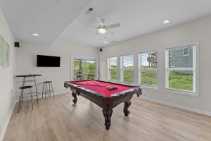 a living room with a pool table in it at 7029 - Just Breathe in Rodanthe