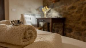 a pile of towels sitting on top of a bed at Agriturismo L'Accolta in Tuoro sul Trasimeno +90 photos