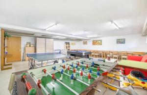 a room with ping pong tables and a table tennis at Holiday Leukerbad Ruhe Natur Berge Free Parking 80 in Leukerbad