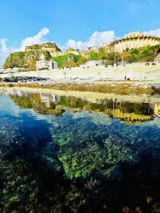 a body of water with a beach and a stadium at Elegance Paema, a 290mt dalle Spiagge! in San Lucido