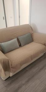 a large bed with two pillows on a wooden floor at Segredo do Lago in Monsaraz