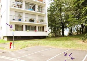 an empty parking lot in front of a building at Quiet Stay near Paris - Balcony & Private Parking in Châtillon